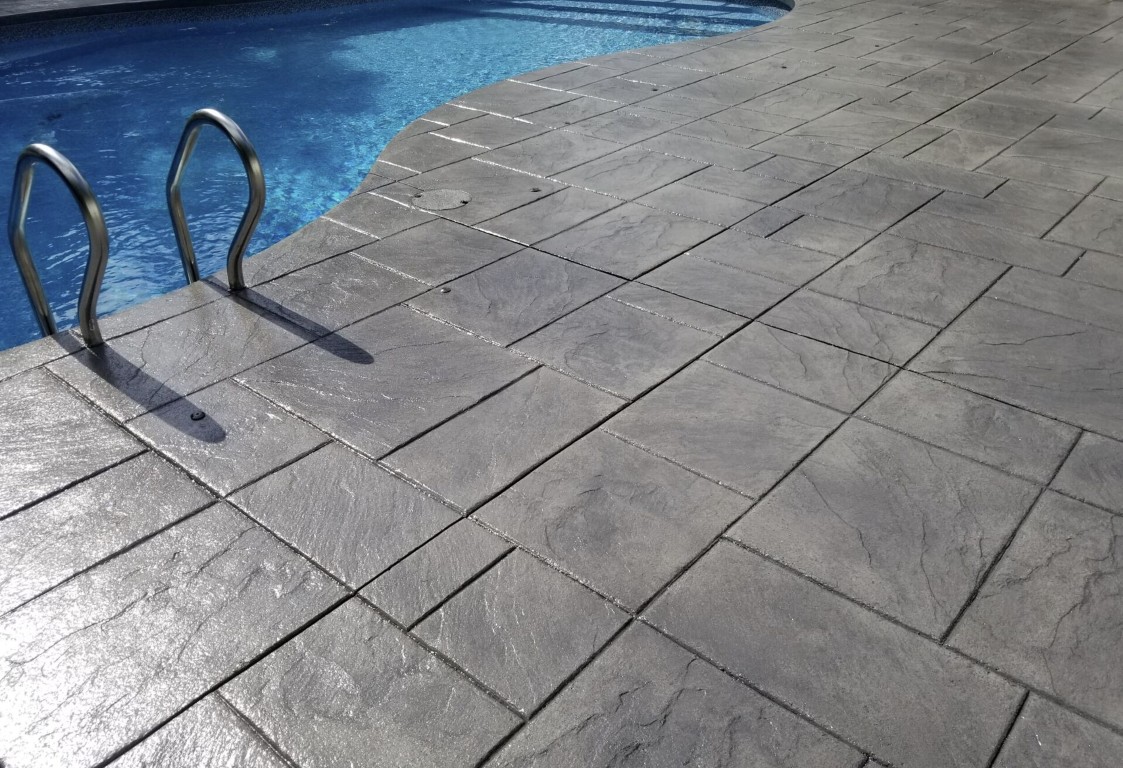 Custom stamped concrete pool deck installation in Springfield, OH